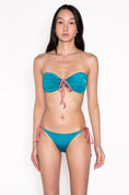 Load image into Gallery viewer, Model wearing Ataya Reversible Tie Side Pant in Teal / Dusty Rose