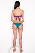 Load image into Gallery viewer, Model wearing Ataya Reversible Tie Side Pant in Emerald / Grape