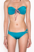 Load image into Gallery viewer, Model wearing Ataya Loop Side Hipster Pant in Teal