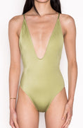 Load image into Gallery viewer, Model wearing Ataya Low V Neck One Piece Swimsuit in Green Leaf
