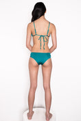 Load image into Gallery viewer, Model wearing Ataya Loop Side Hipster Pant in Emerald
