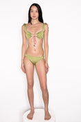 Load image into Gallery viewer, Model wearing Ataya Loop Side Hipster Pant in Green Leaf
