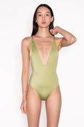 Load image into Gallery viewer, Model wearing Ataya Low V Neck One Piece Swimsuit  in Green Leaf
