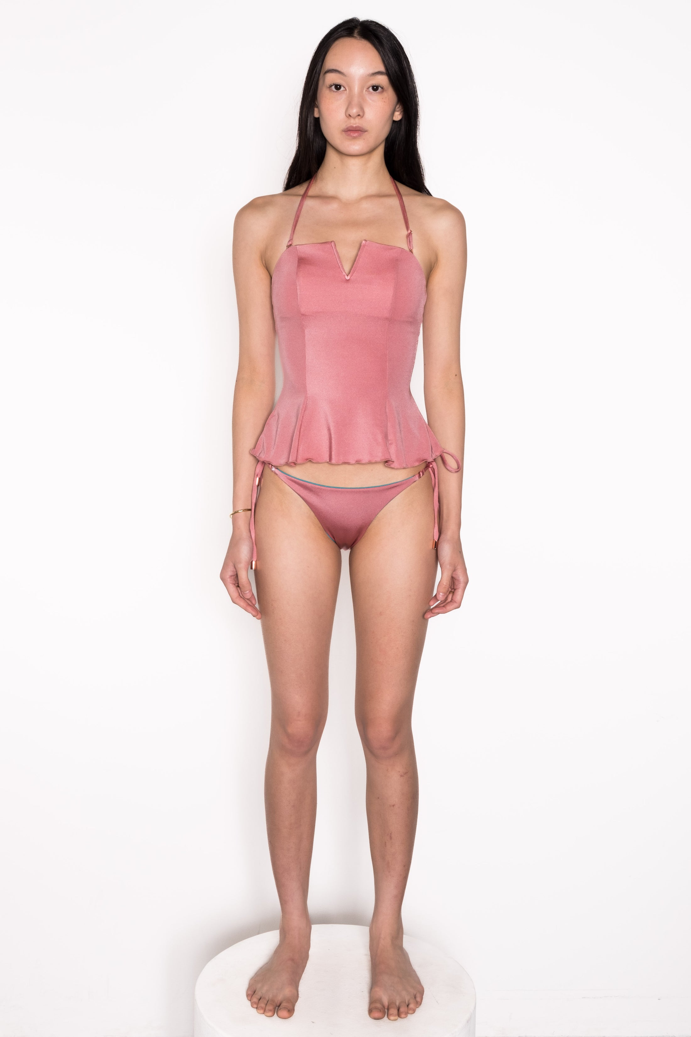 Model wearing Ataya Reversible Tie Side Pant in Teal / Dusty Rose