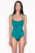 Load image into Gallery viewer, Model wearing Ruched Bust Shoestring One Piece Swimsuit in Emerald
